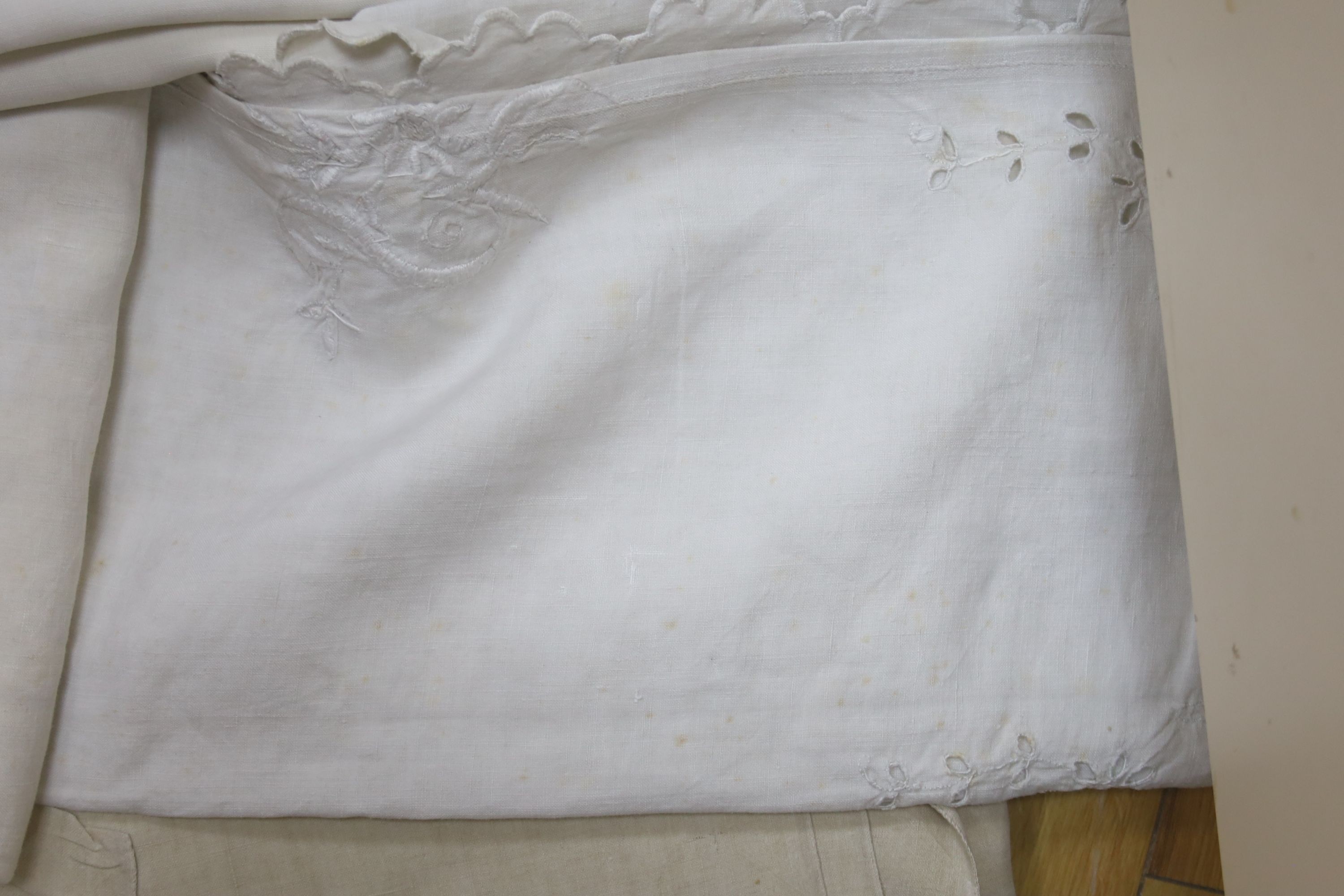 Six French provincial embroidered and cutworked sheets